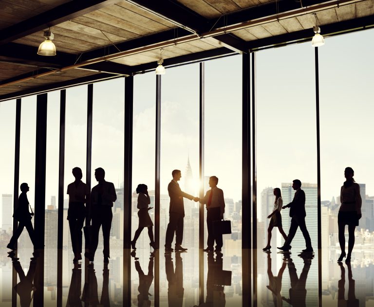 Silhouettes of businesspeople walking